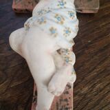 Child on the polychrome plaster cross