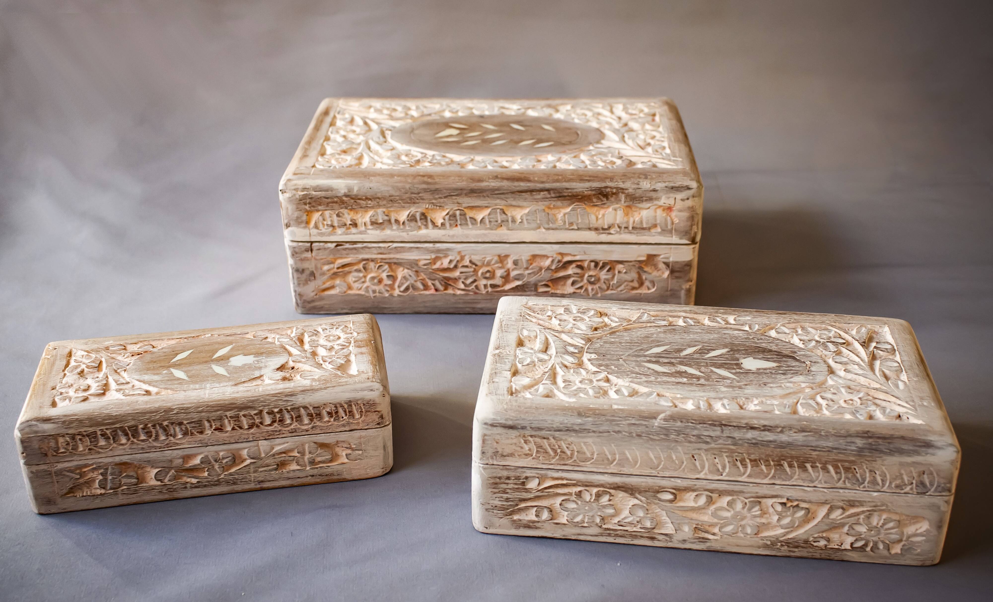 Hand-carved wooden boxes with ivory inlays