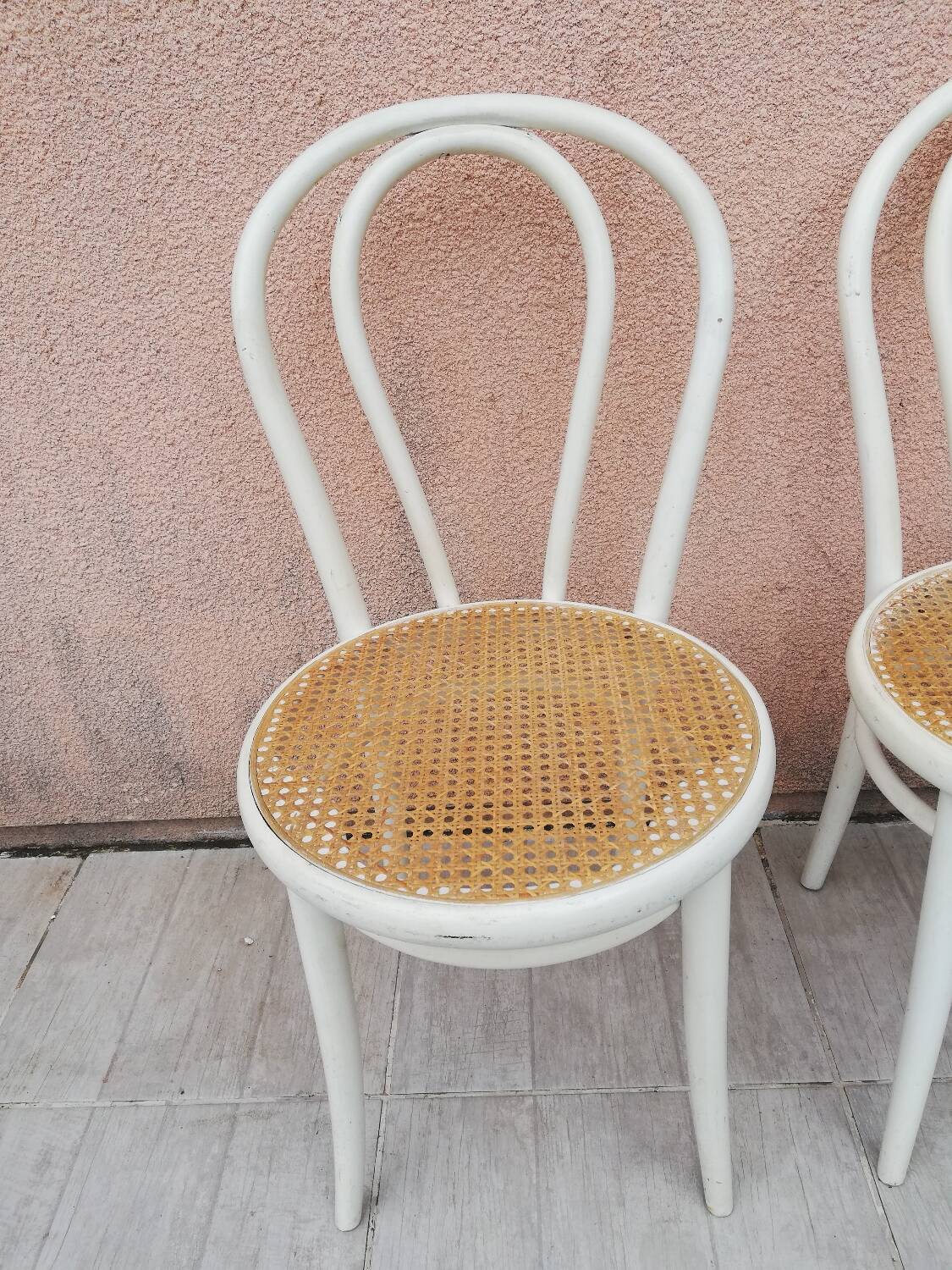 Lot of three Vintage ecru natural cane bistro chairs