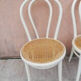 Lot of three Vintage ecru natural cane bistro chairs