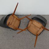 2 chaises en skaï noir pieds compas Louis Paolozzi