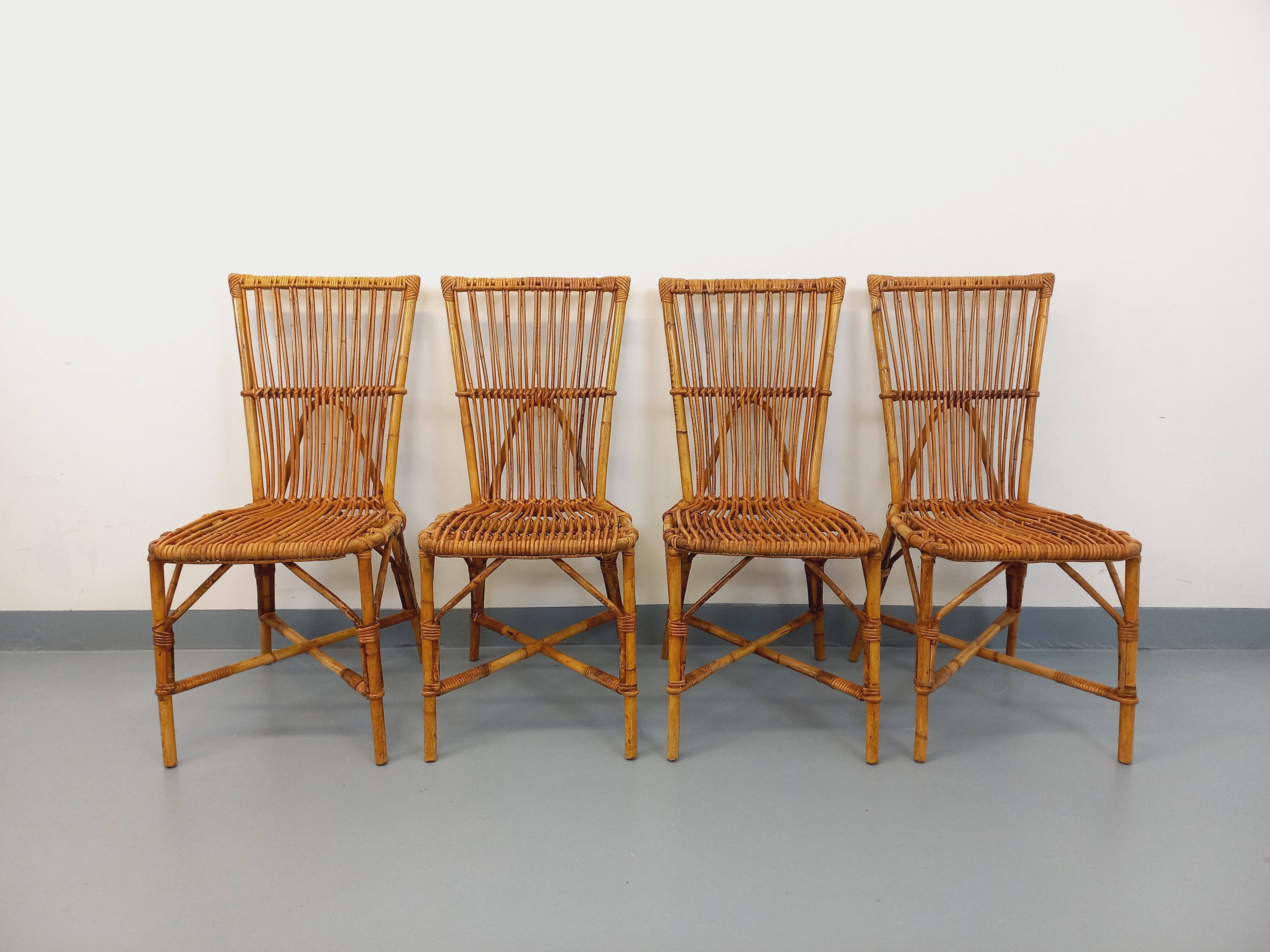Set of 4 vintage Audoux Minet rattan chairs from the 1950s and 60s.