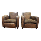Paire de fauteuils Club en cuir usés