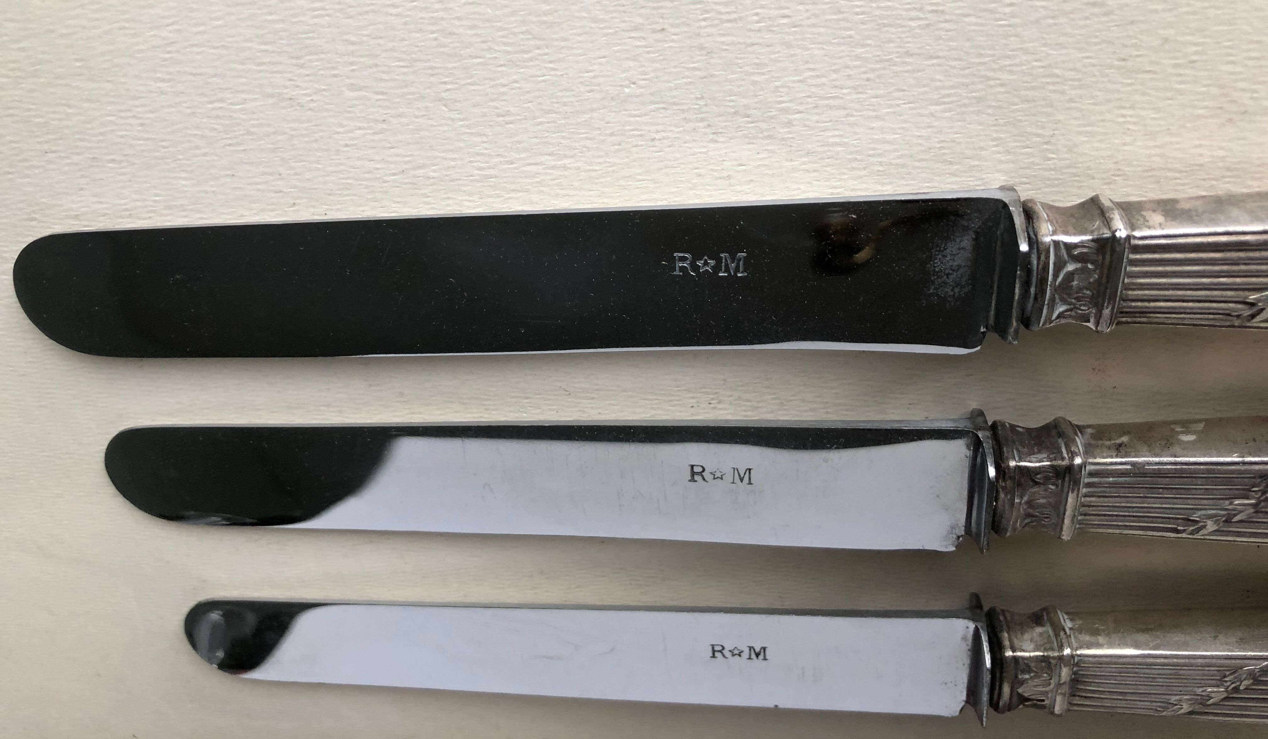 Set of 12 silver metal knives