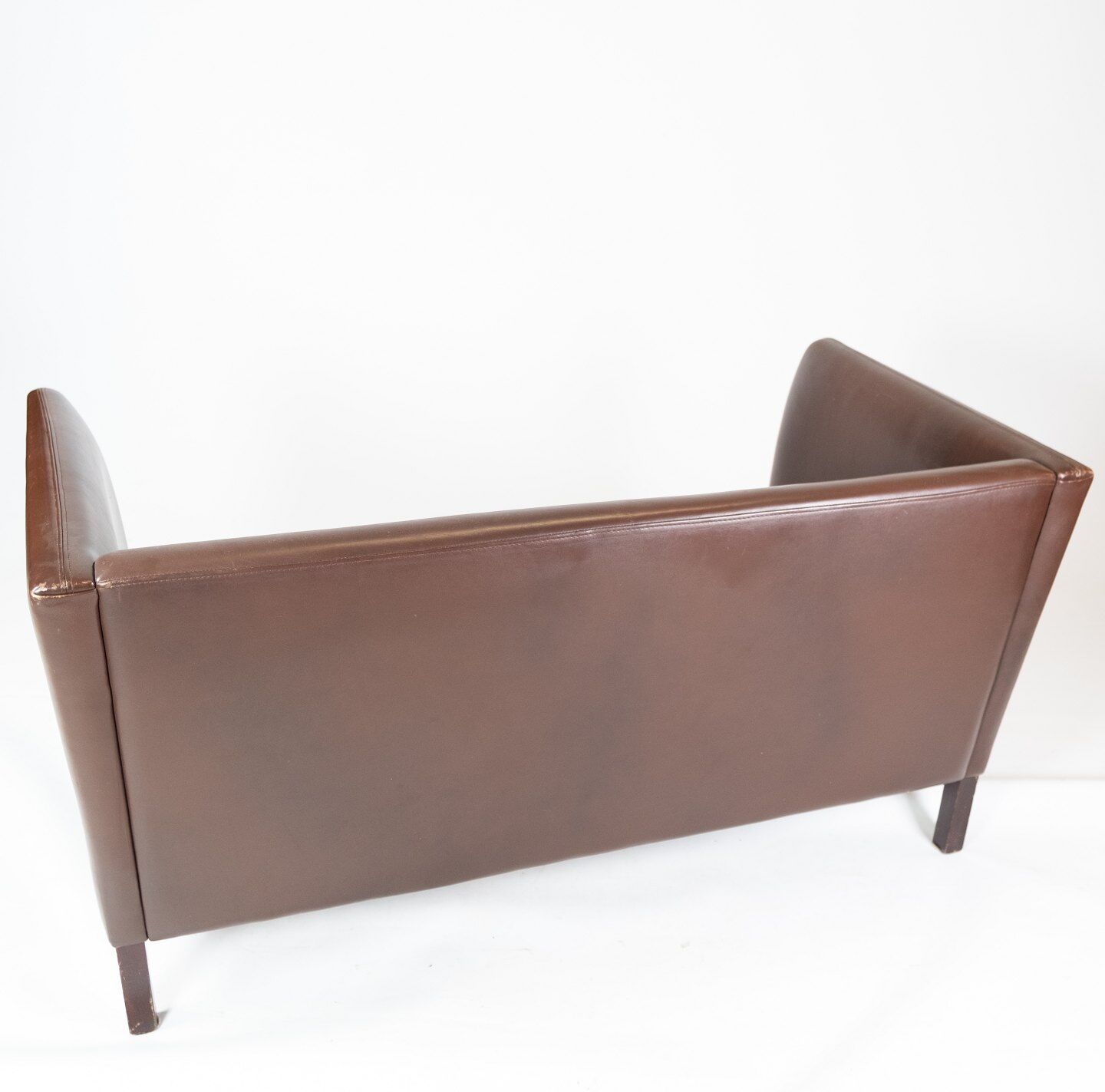 Two seater sofa upholstered with dark brown leather of danish design , by Stouby Furniture