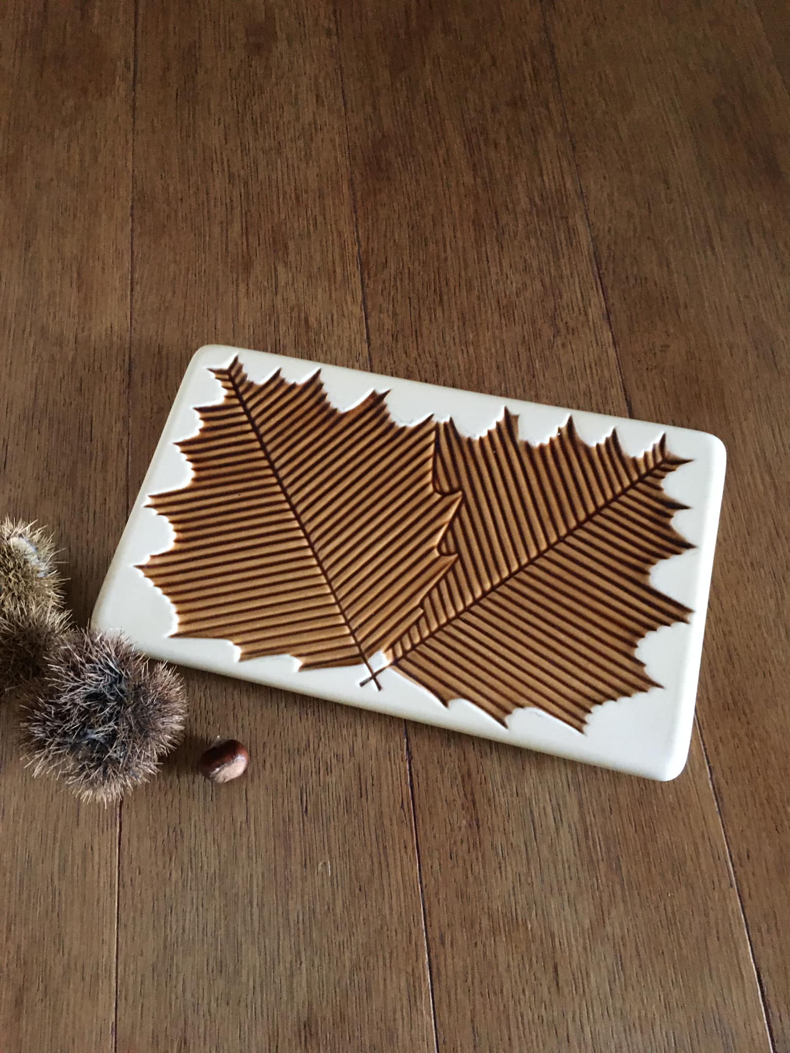 Antique rectangular ceramic trivia with inlaid leaves