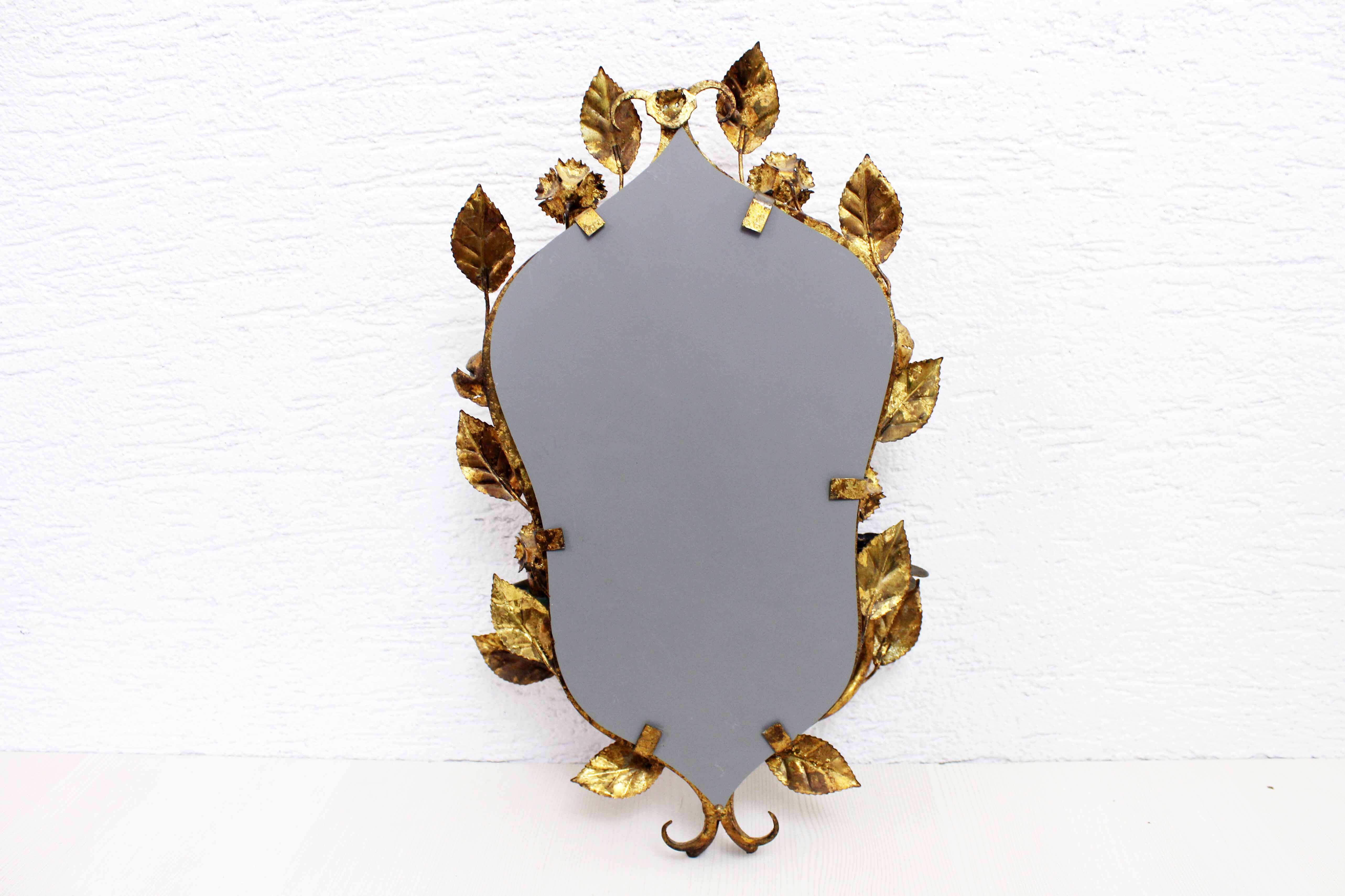 Old candlestick mirror gilded with leaf