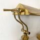 Pair of notary-style lamps in gilded metal