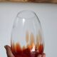 Vintage blown glass vase with a speckled red design