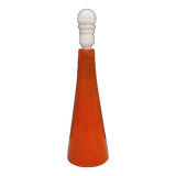 Ceramic table lamp with partial orange glaze.
