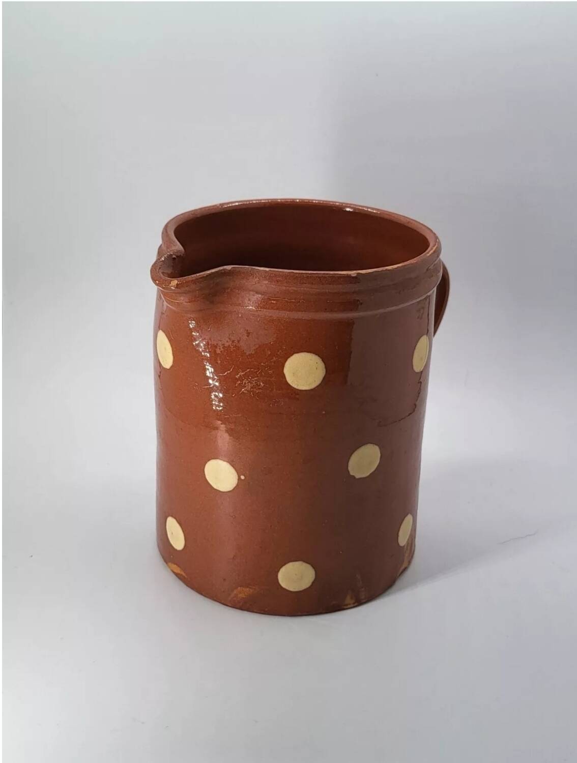 Old pitcher with polka dots savoyard pottery in glazed terracotta alsace