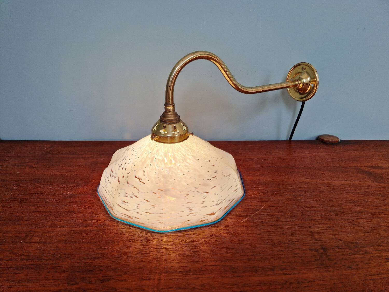 Brass and blue speckled glass wall light
