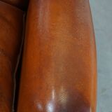 Sheepskin leather wingback chair with patina