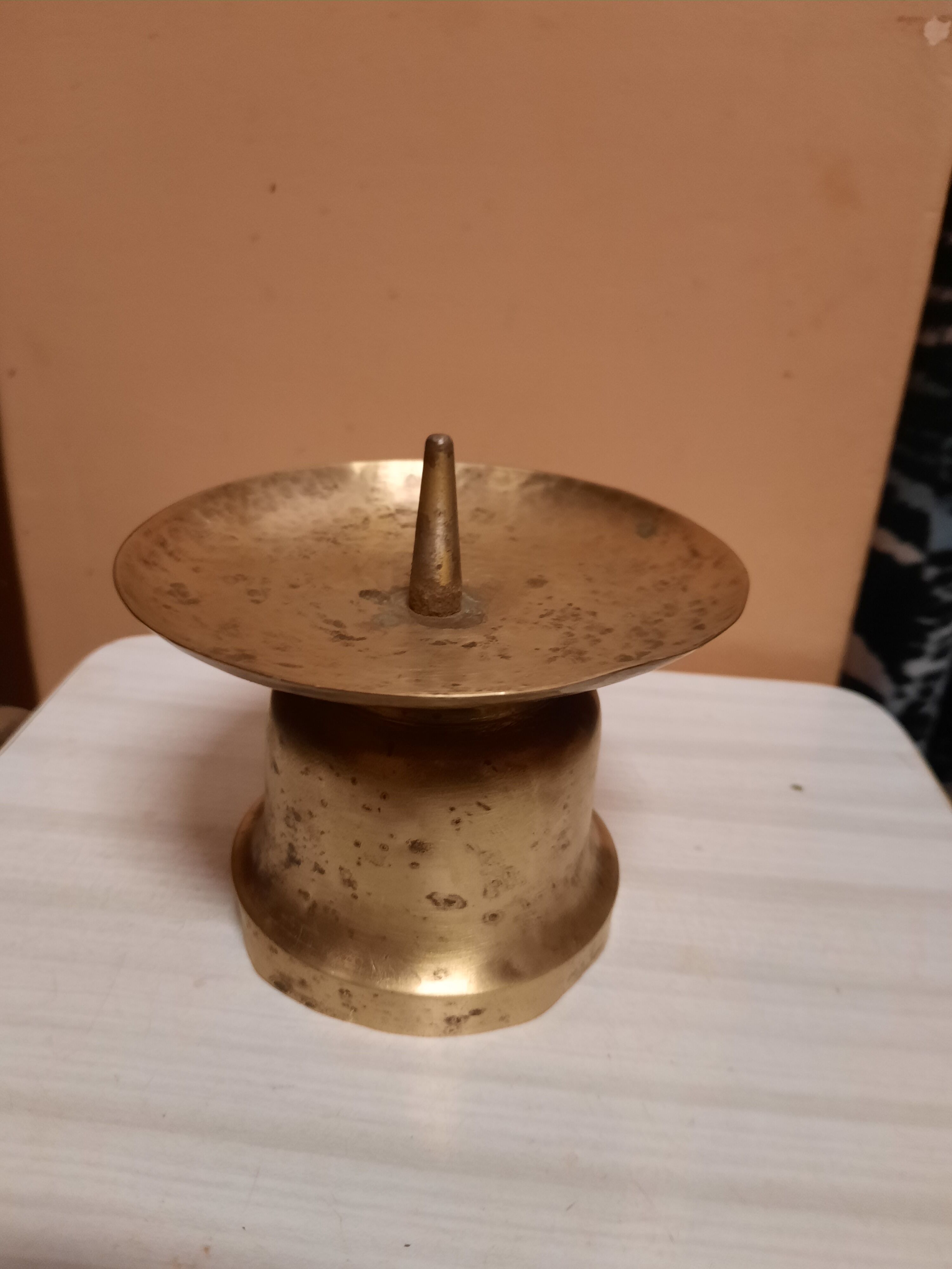 Brass candle pique