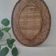 Oval mirror in woven wicker