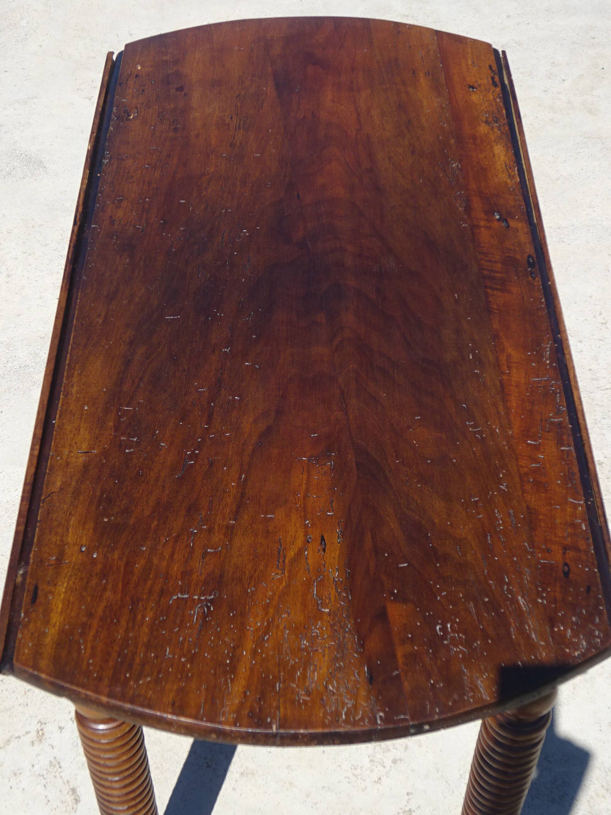 Antique walnut console table with honey spoon legs.