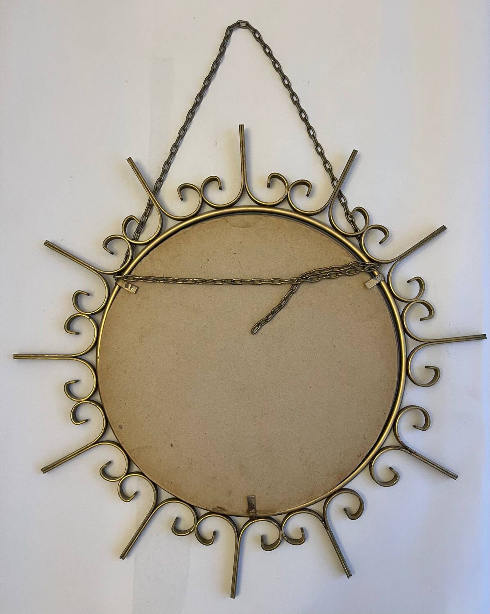 Miroir soleil en métal doré