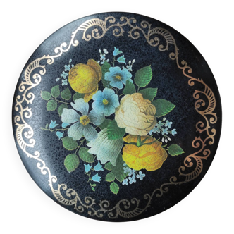 Round metal box decorated with flowers