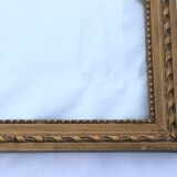 Gilded wooden frame and its glass