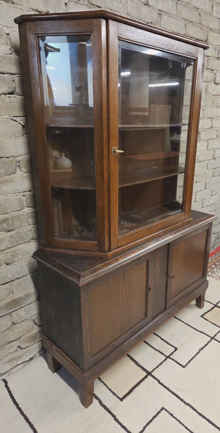 Vintage two-body display cabinet in oak from the 1950s.