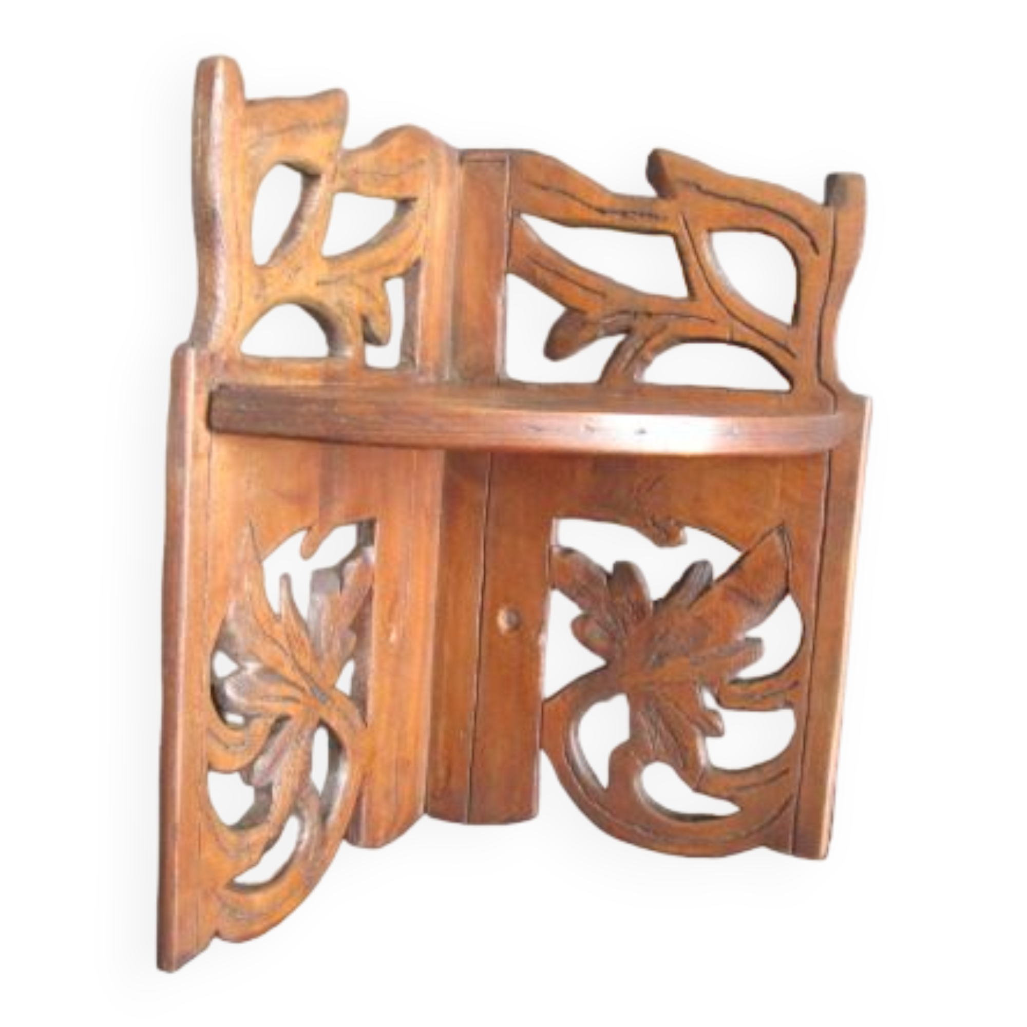 Old corner shelf in worked wood