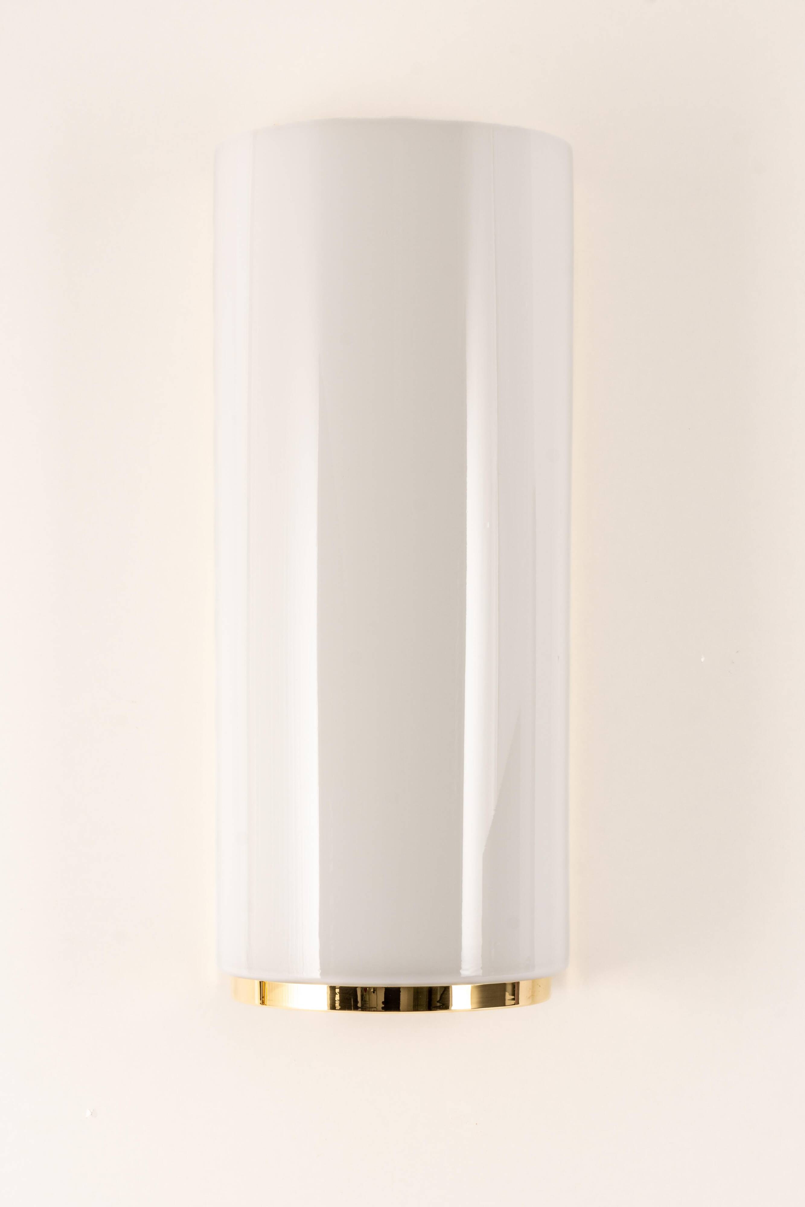 Pair of large opaline glass wall lights in brass designed by Limburg, Germany.