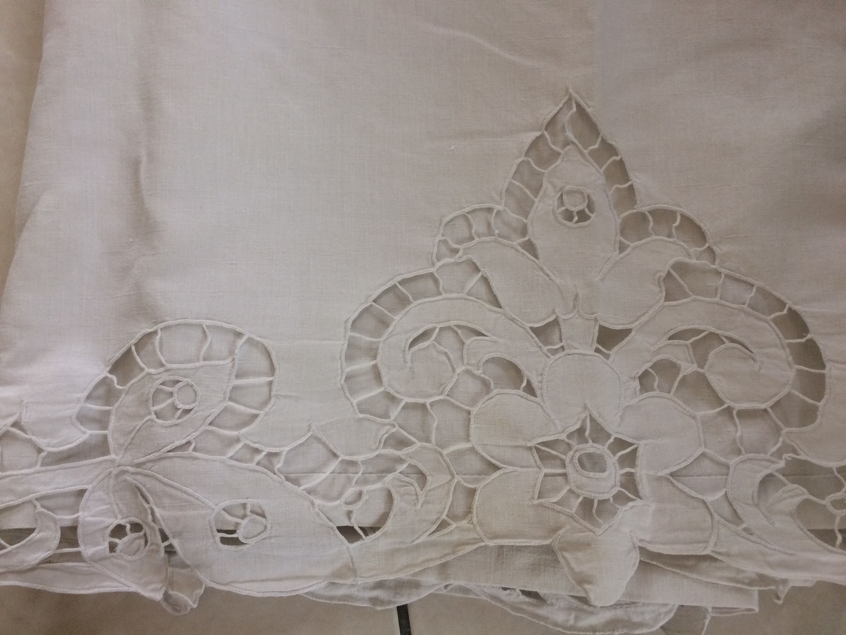 Old sheet with monograms and wide hand made embroider.