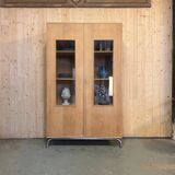 Glass-fronted school cabinet in raw oak