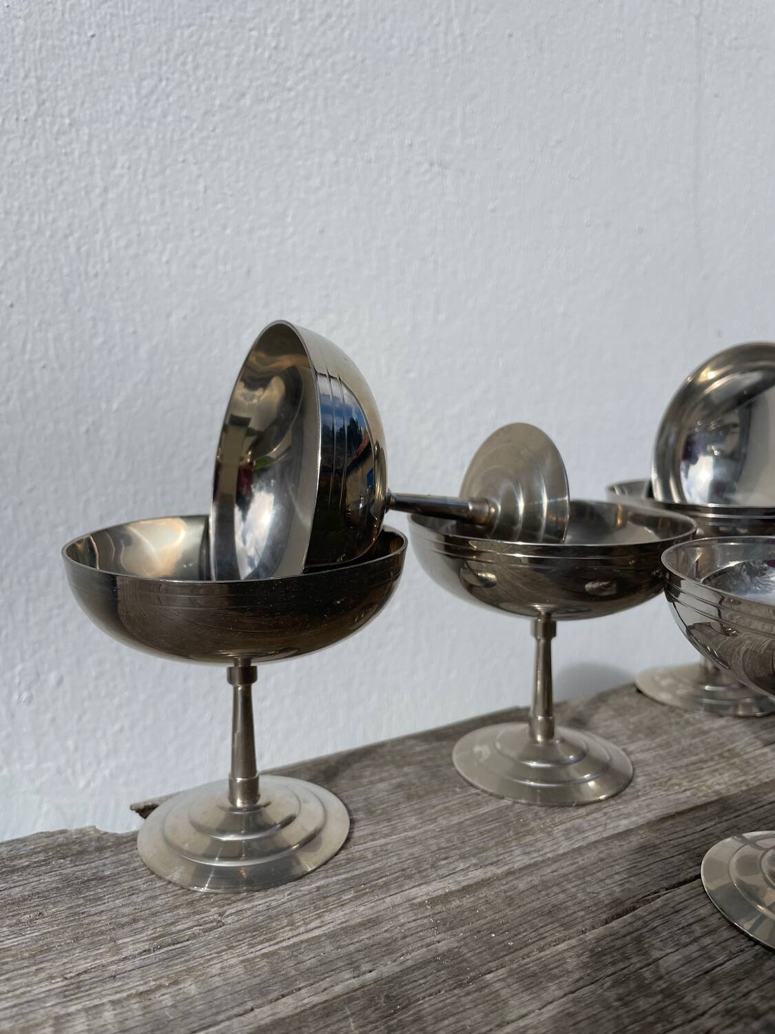 10 stainless steel cups signed Rémy Letang