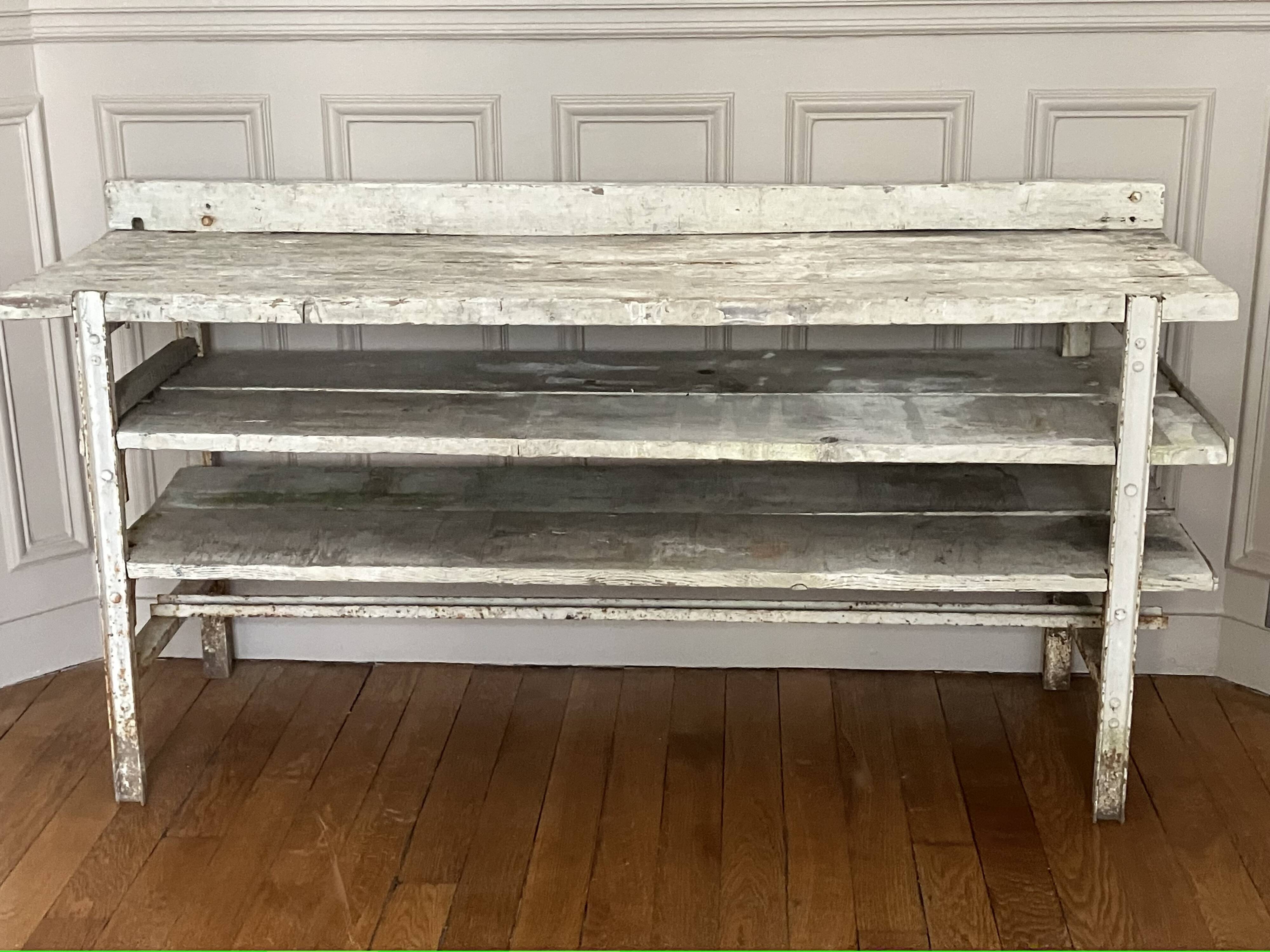 Old workbench, a piece of wooden and metal furniture.