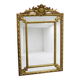Rectangular glass with a golden frame and a pediment adorned with laurel branches.