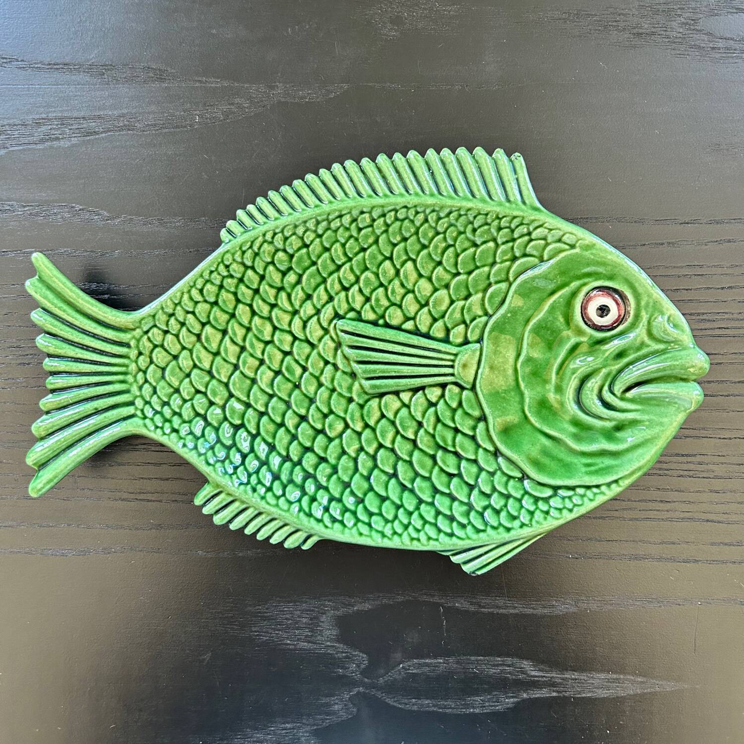 Fish dish in green earthenware