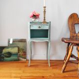 Patinated bedside table end of sofa