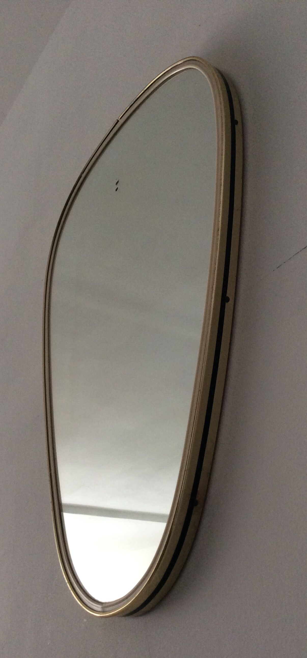 Asymmetrical free-form mirror from the 70s
