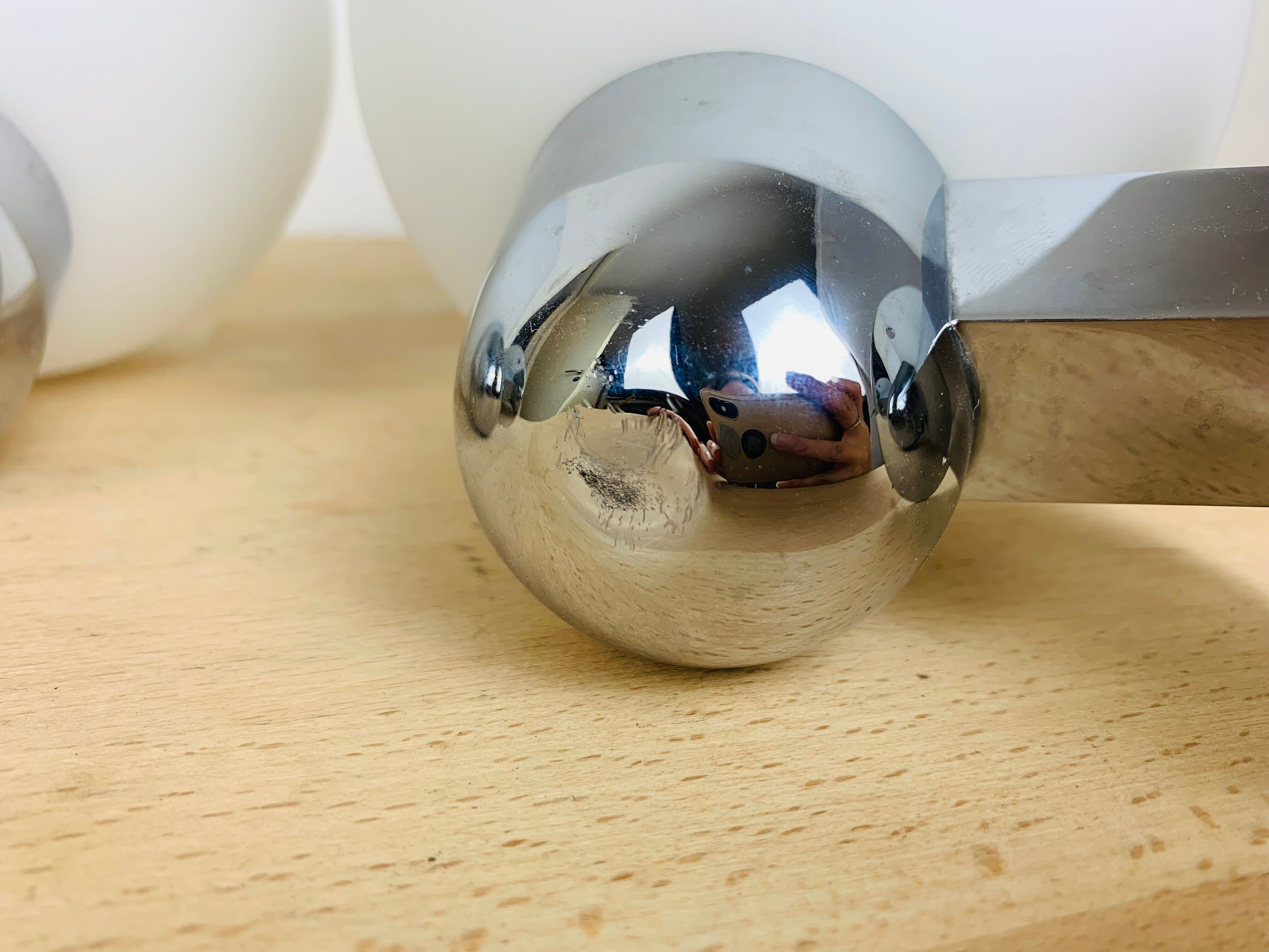 Pair of wall lamps space age chrome and opal globe 70s