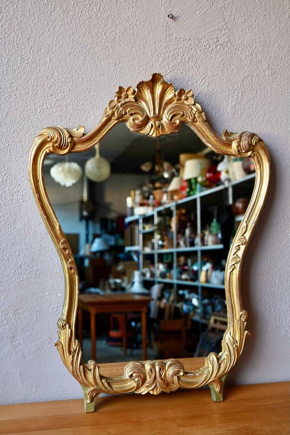 Baroque gold table mirror in Louis XV style, carved and stuccoed wood.