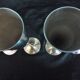 Lot of 12 silver metal flutes on brass stand