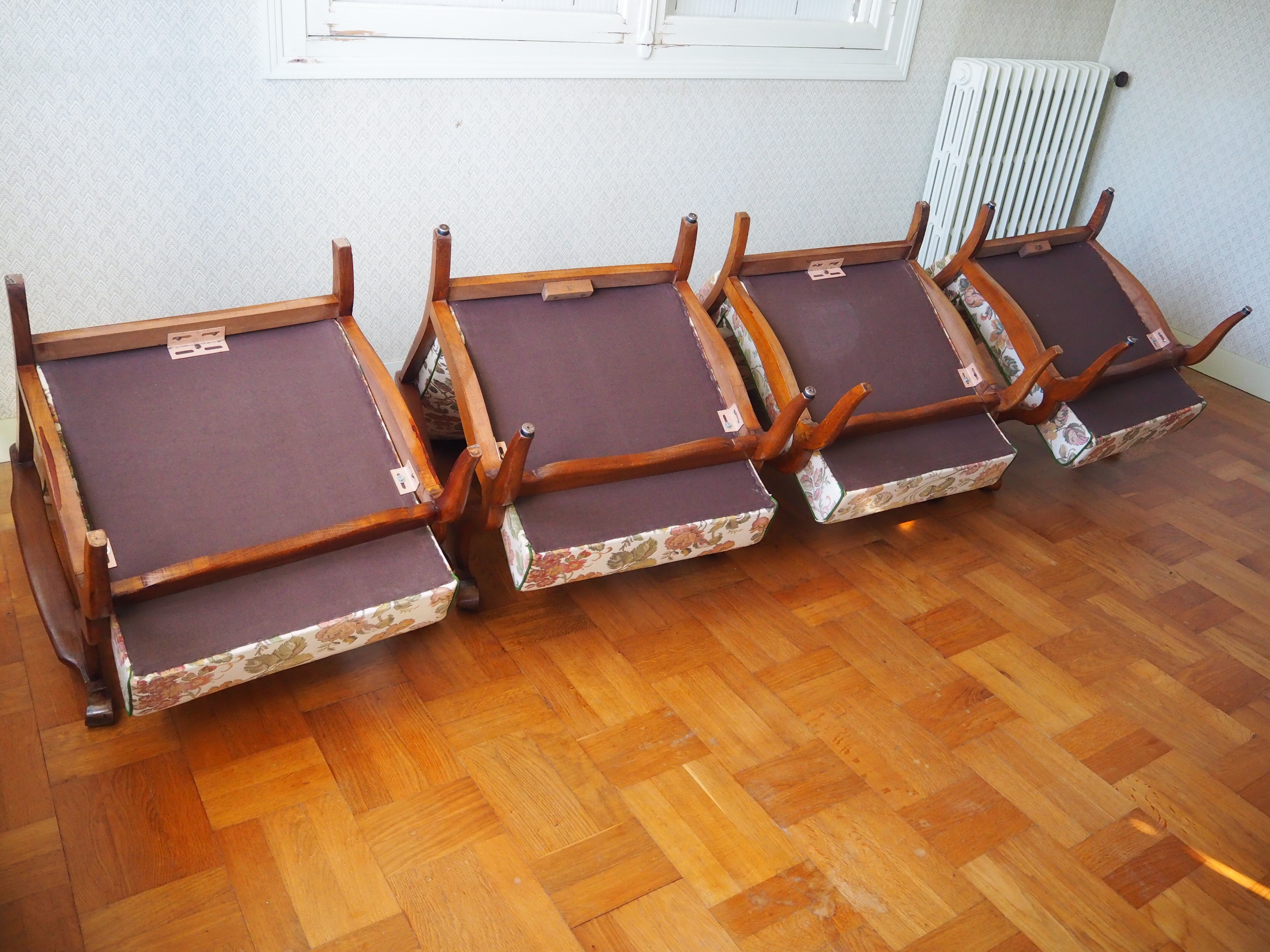 Four 1950s armchairs - wooden armrests
