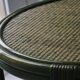 Green rattan side table.