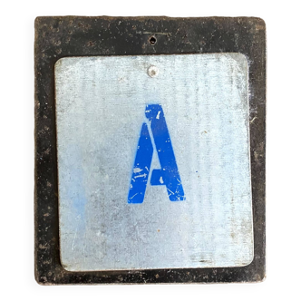 Metal letter A on plaque