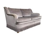 Vintage taupe two-seater armchair/sofa with fringes.