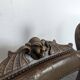 Curule chair Dagobert in carved walnut with lion heads.