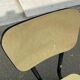 Yellow formica and black steel chair from the 1970s.