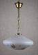 White glass pendant light with flower motif.