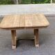 Rectangular Art Deco dining table with a central pedestal, stripped in solid oak.