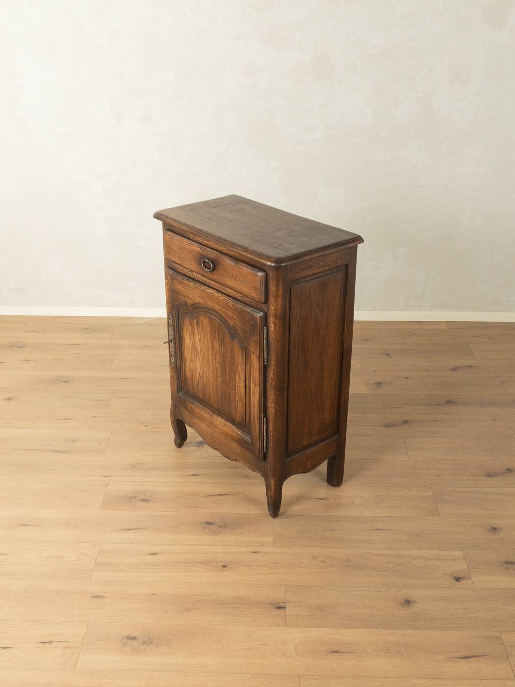 Antique chest of drawers with curved silhouette and patina
