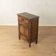Antique chest of drawers with curved silhouette and patina