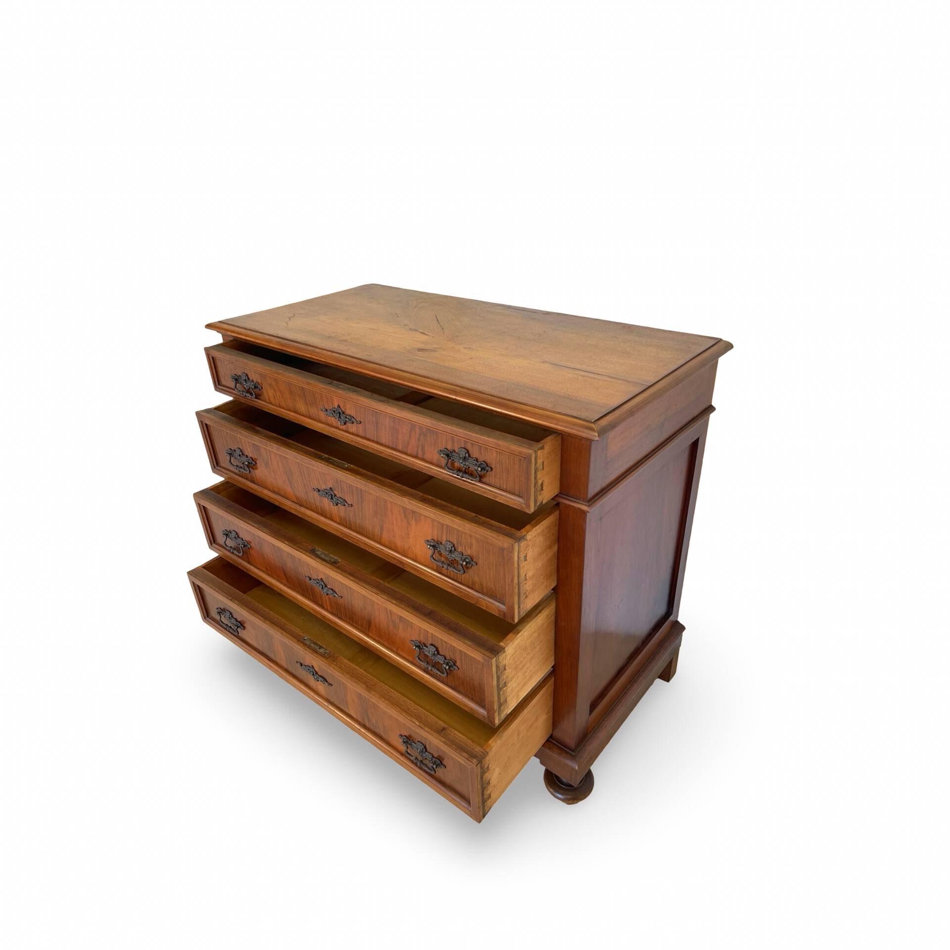 Antique walnut commode with bronze handles in the shape of a lion's mask,
