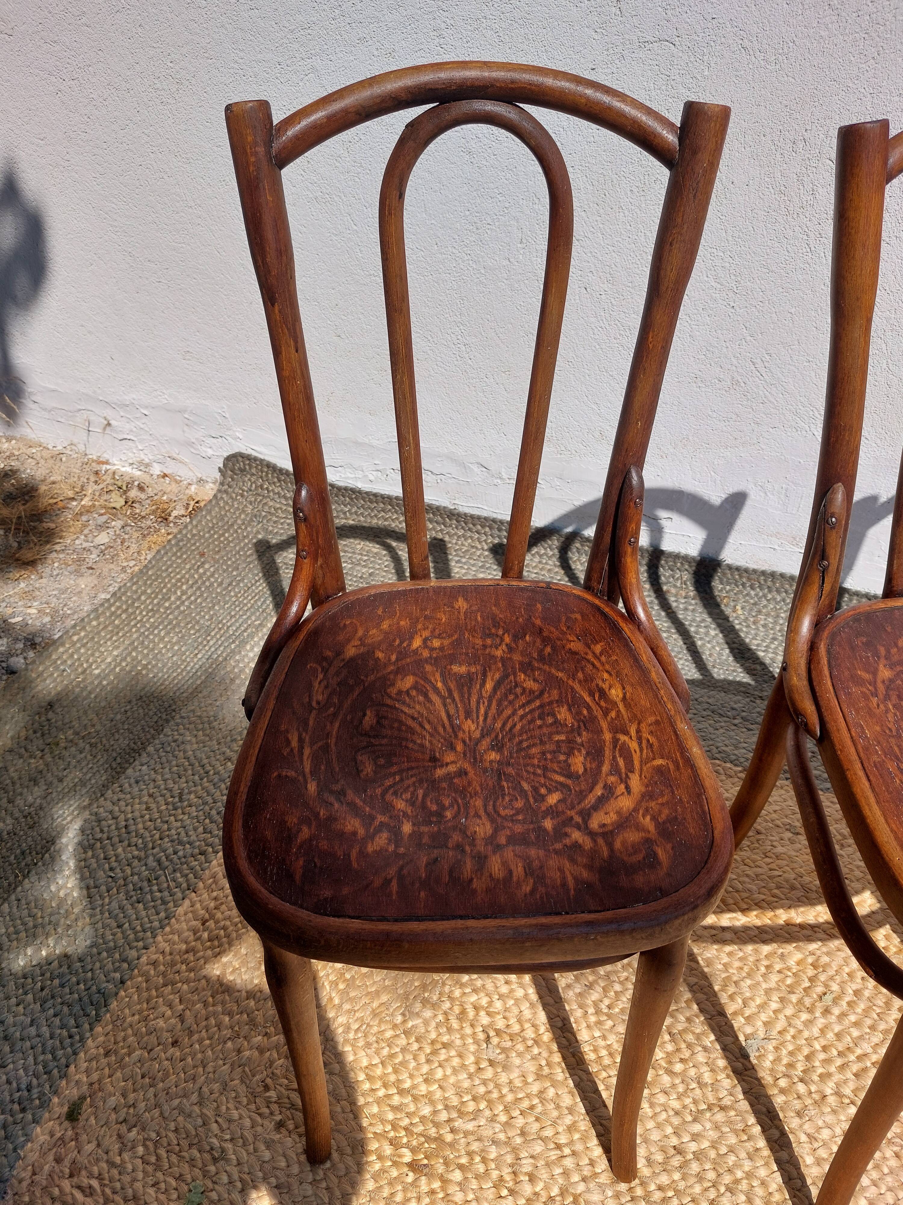 set of 3 curved wooden bistro chairs with patterns