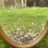 Miroir ovale doré biseauté, 79 x 59 cm